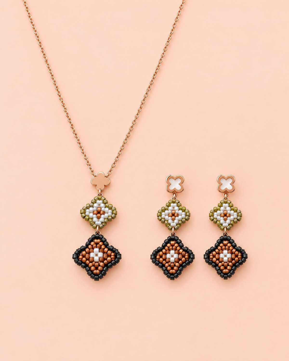 Bronze Clover Necklace Set with matching earrings on peach background