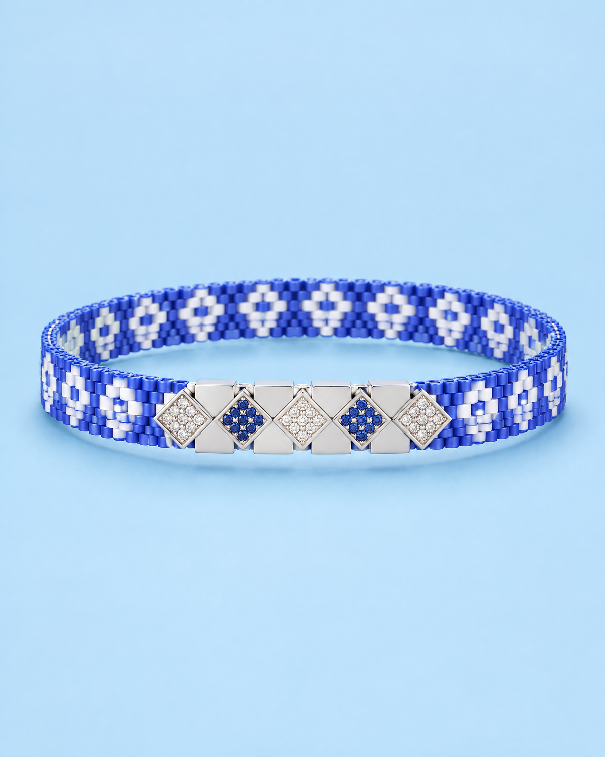 Navy Blossom Loom Cuff on blue background