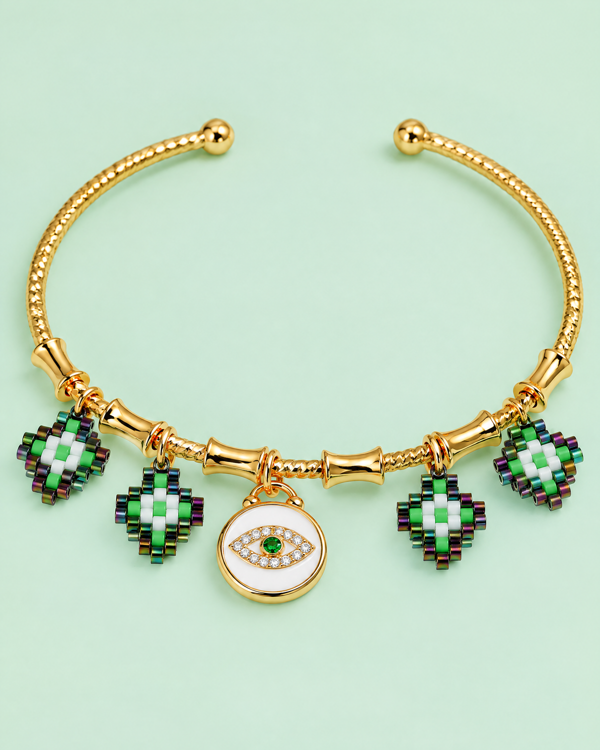 Emerald Evil Eye Bangle on mint background
