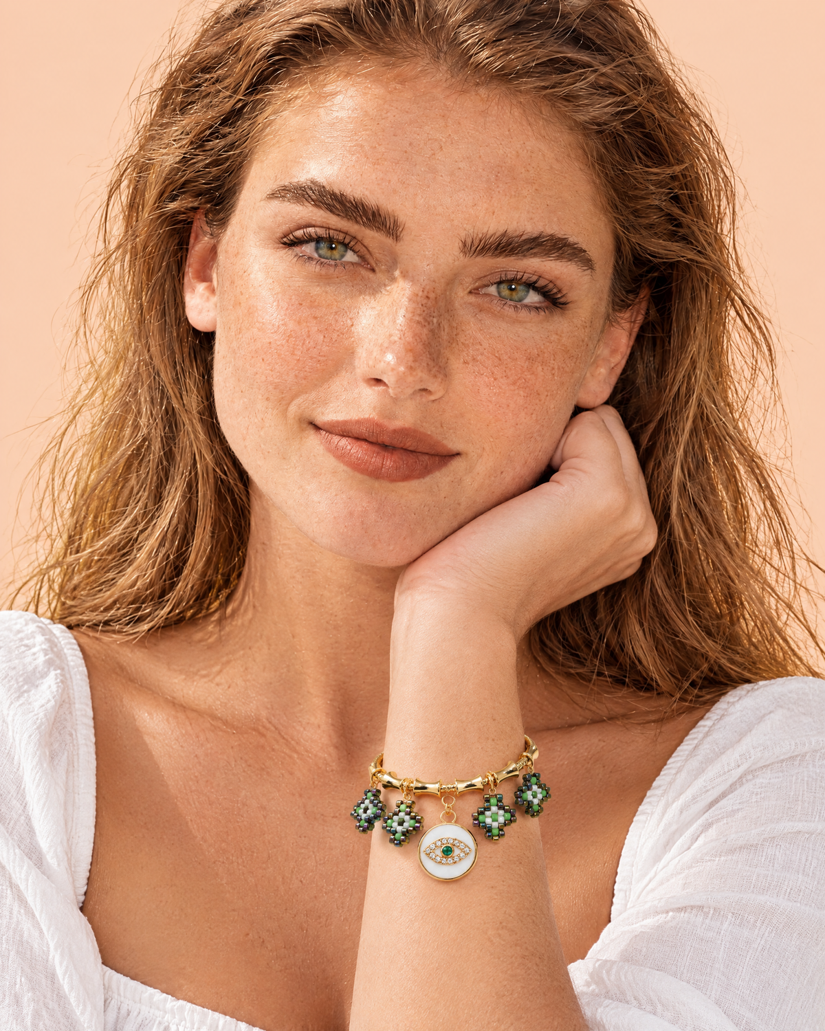 Emerald Evil Eye Bangle worn on the wrist