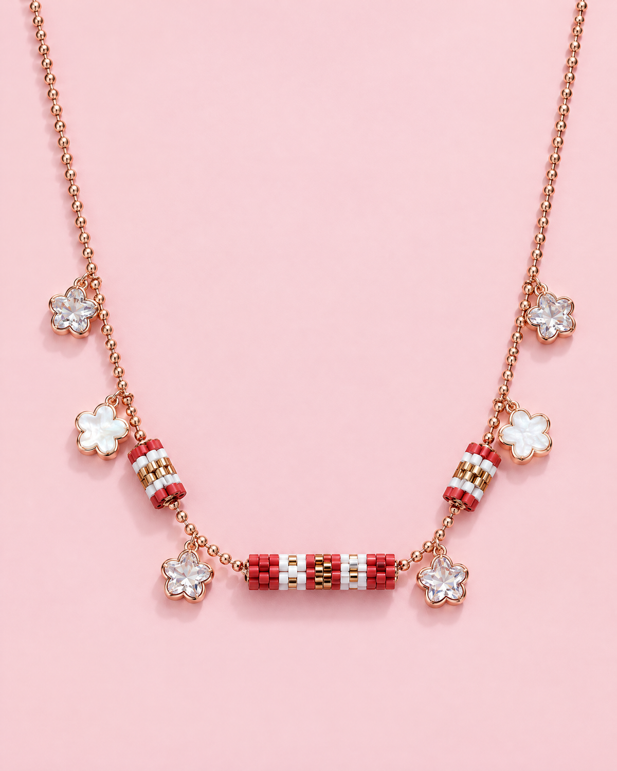 Red Barrel Charm Necklace on pink background