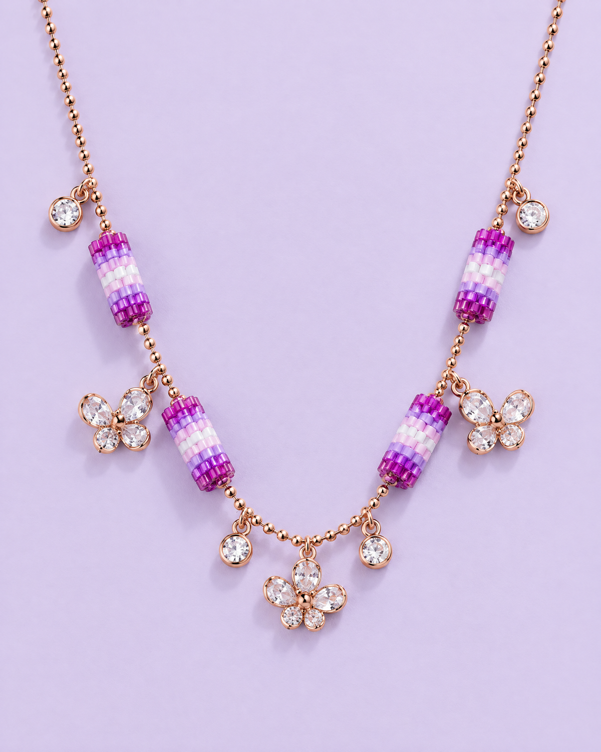 Lilac Butterfly Charm Necklace on lavender background