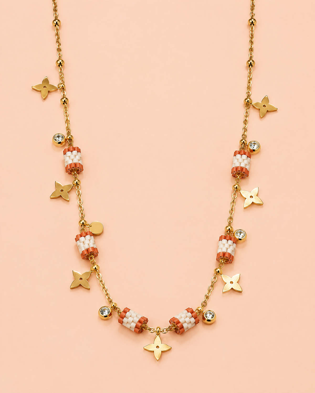 Terracotta Star Charm Necklace on peach background
