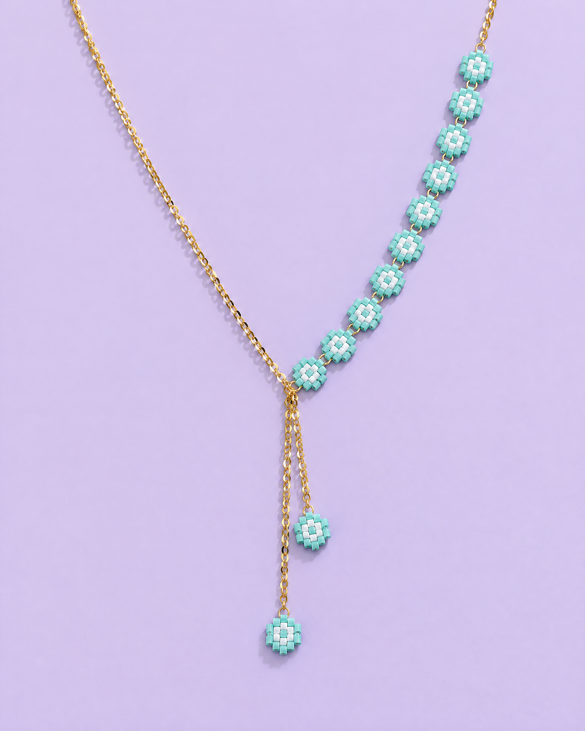 Turquoise Daisy Lariat on lavender background