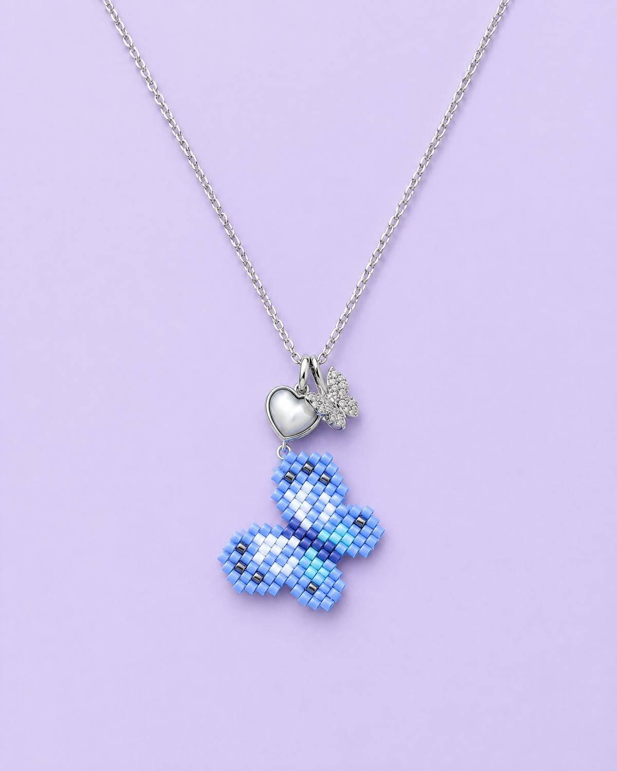 Blue Butterfly Pendant on lavender background