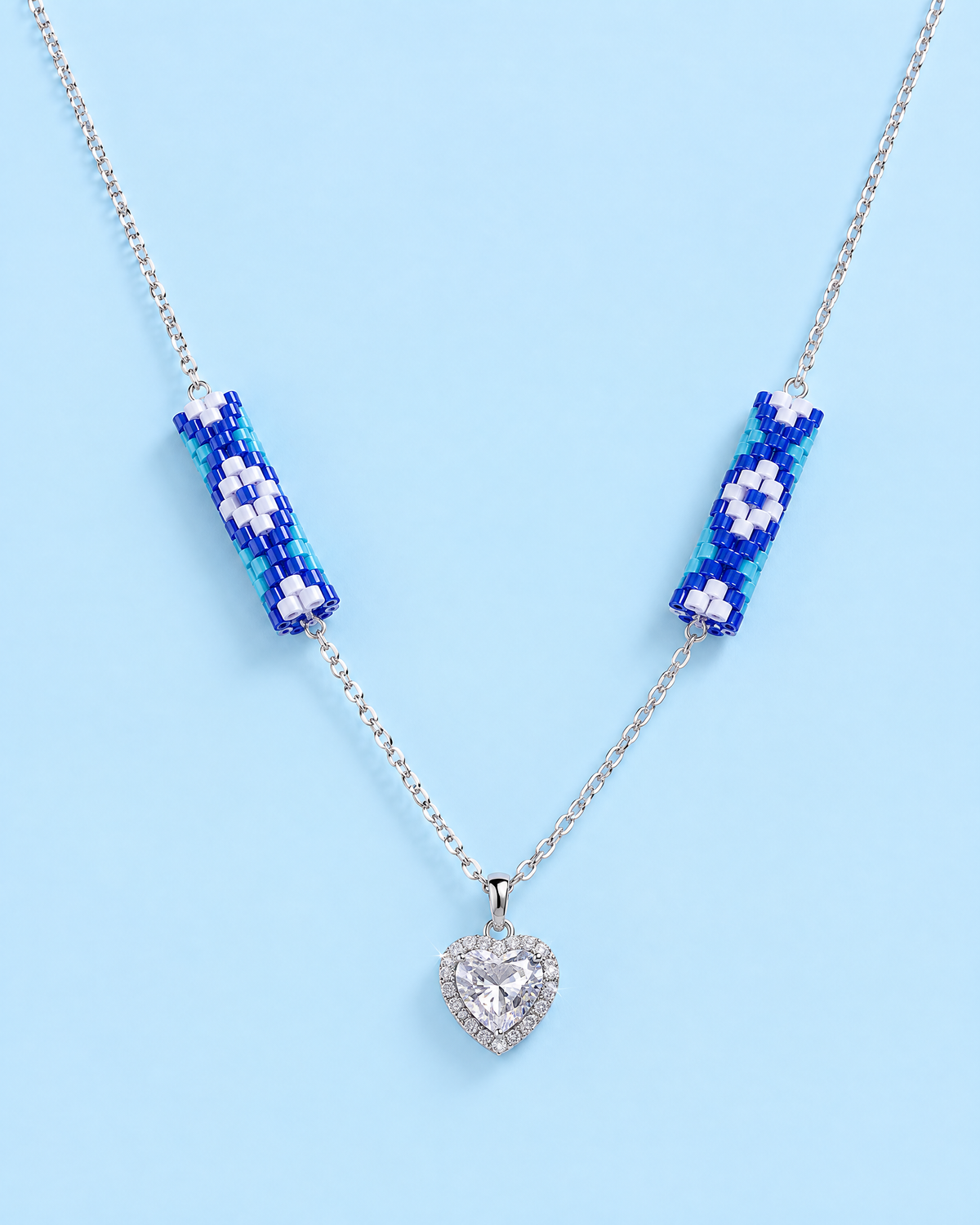 Cobalt Daisy Heart Pendant on blue background