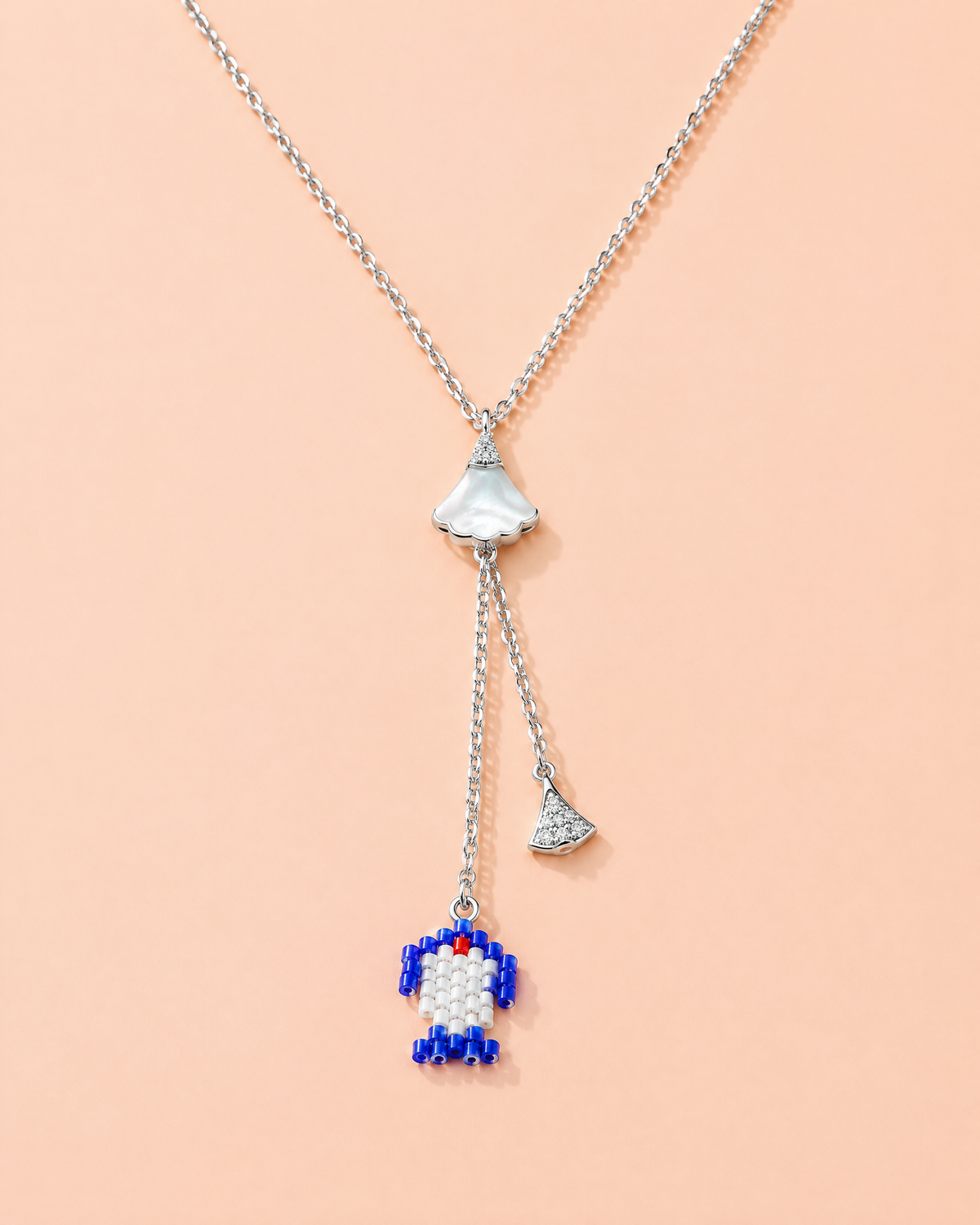 Cobalt Fan Lariat on peach background