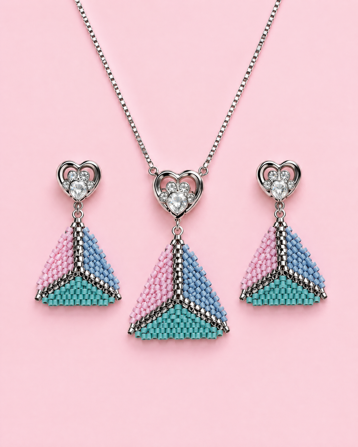 Pastel Pyramid Necklace Set with matching earrings on pink background