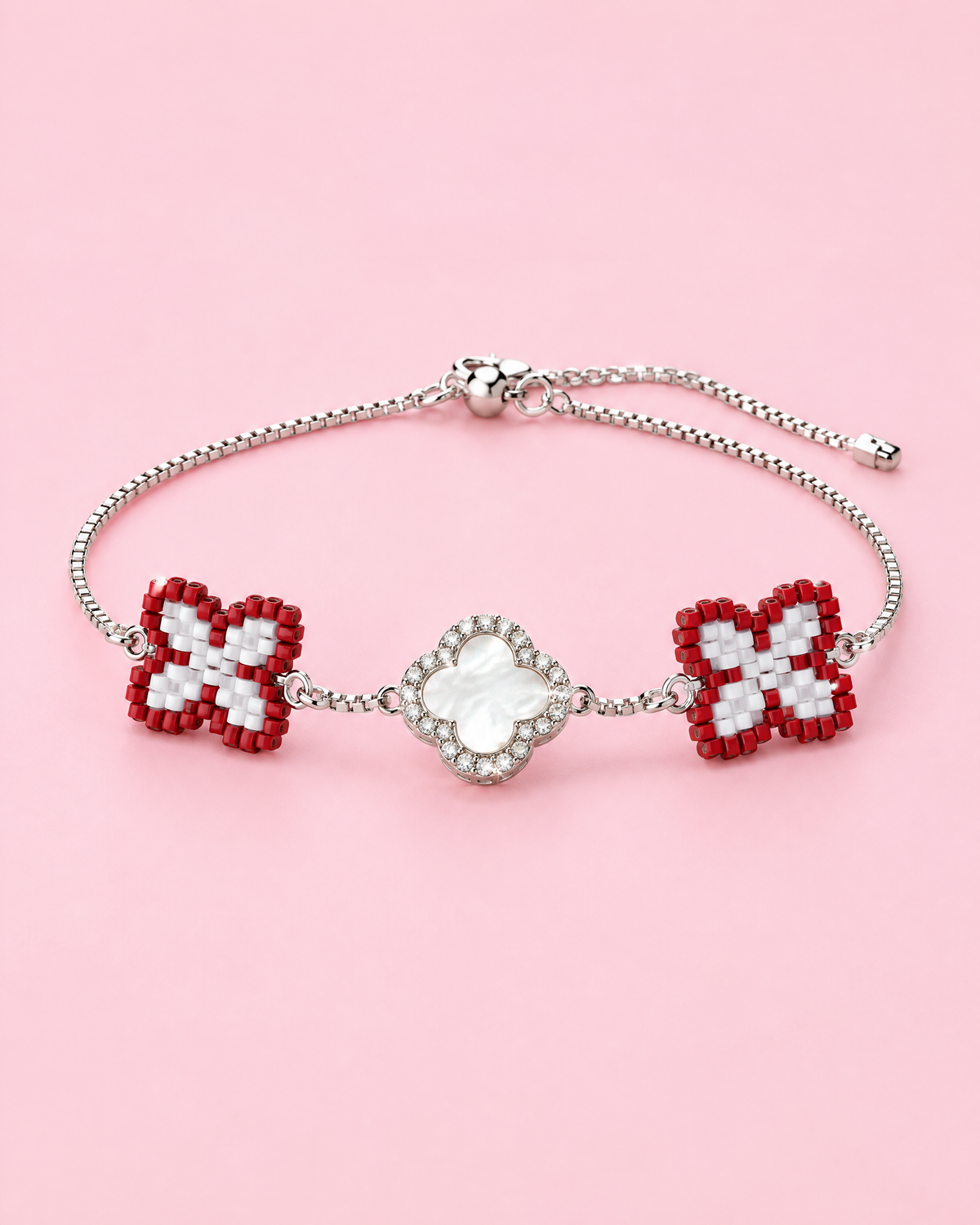 Red Clover Charm Bracelet on pink background