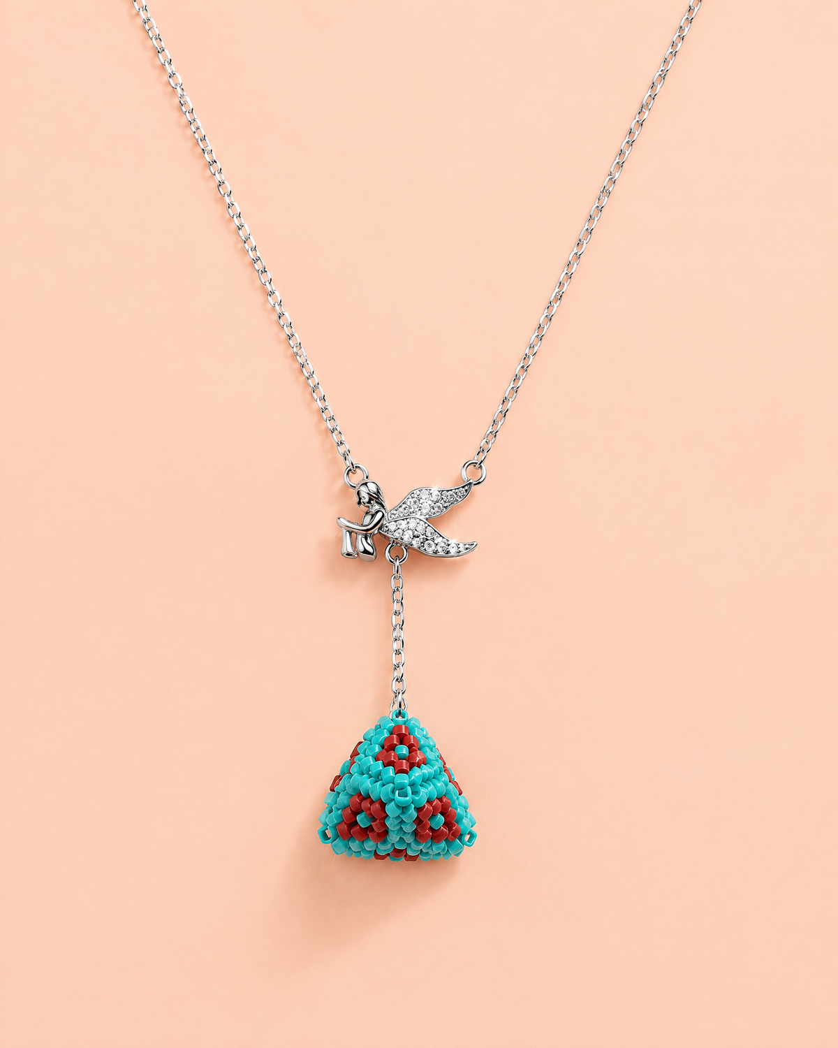 Turquoise Angel Lariat on peach background