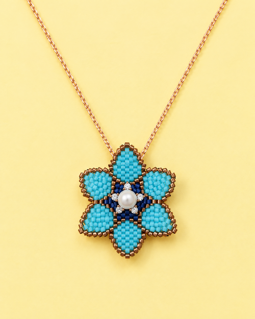 Turquoise Blossom Pendant on yellow background