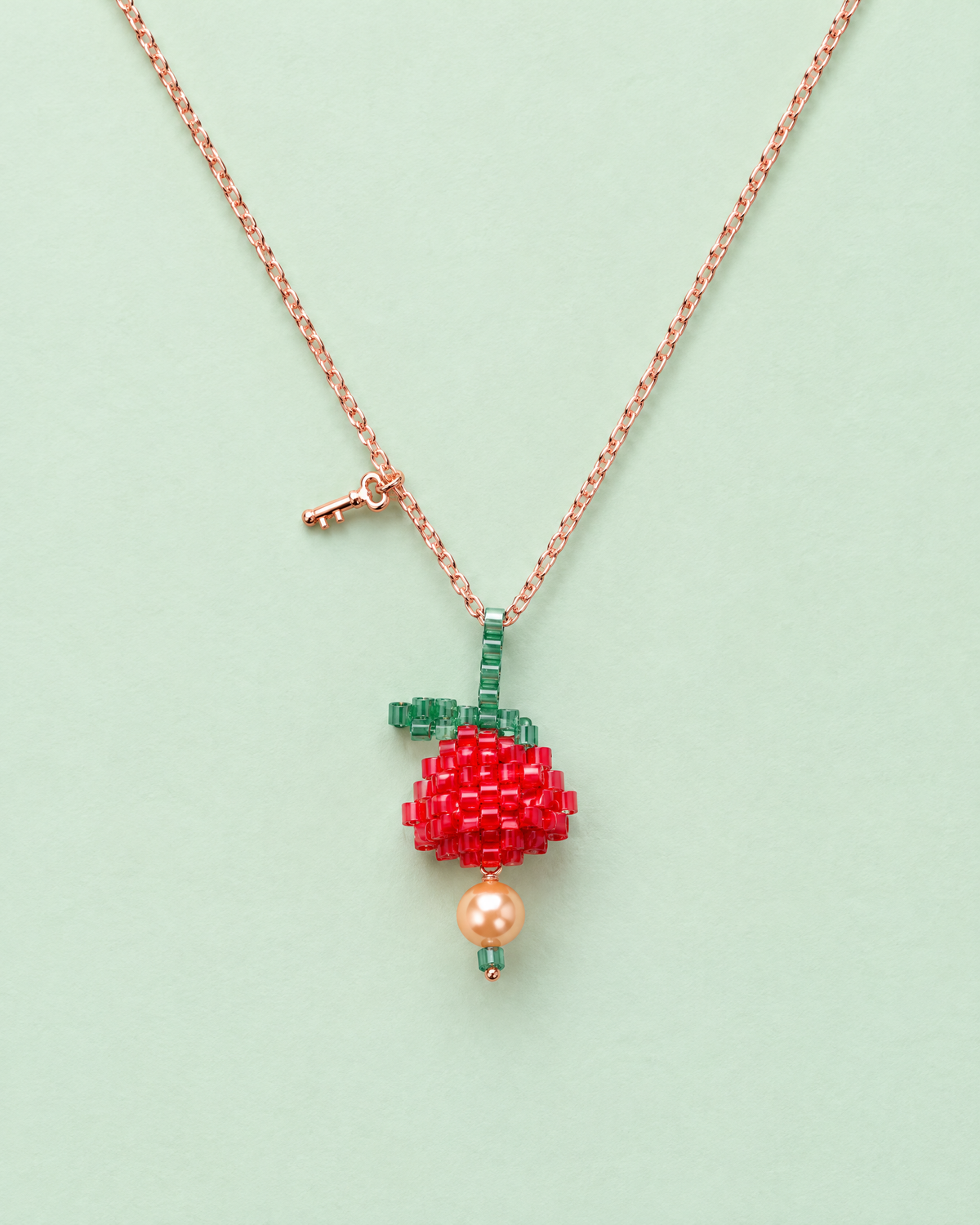 Scarlet Bloom Pendant on mint background