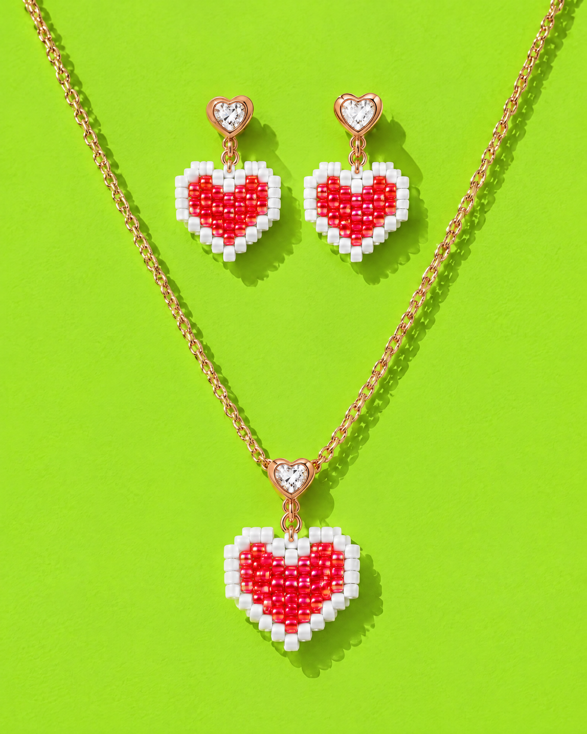 Scarlet Heart Necklace Set with crystal heart bail and matching earrings on a lime green background